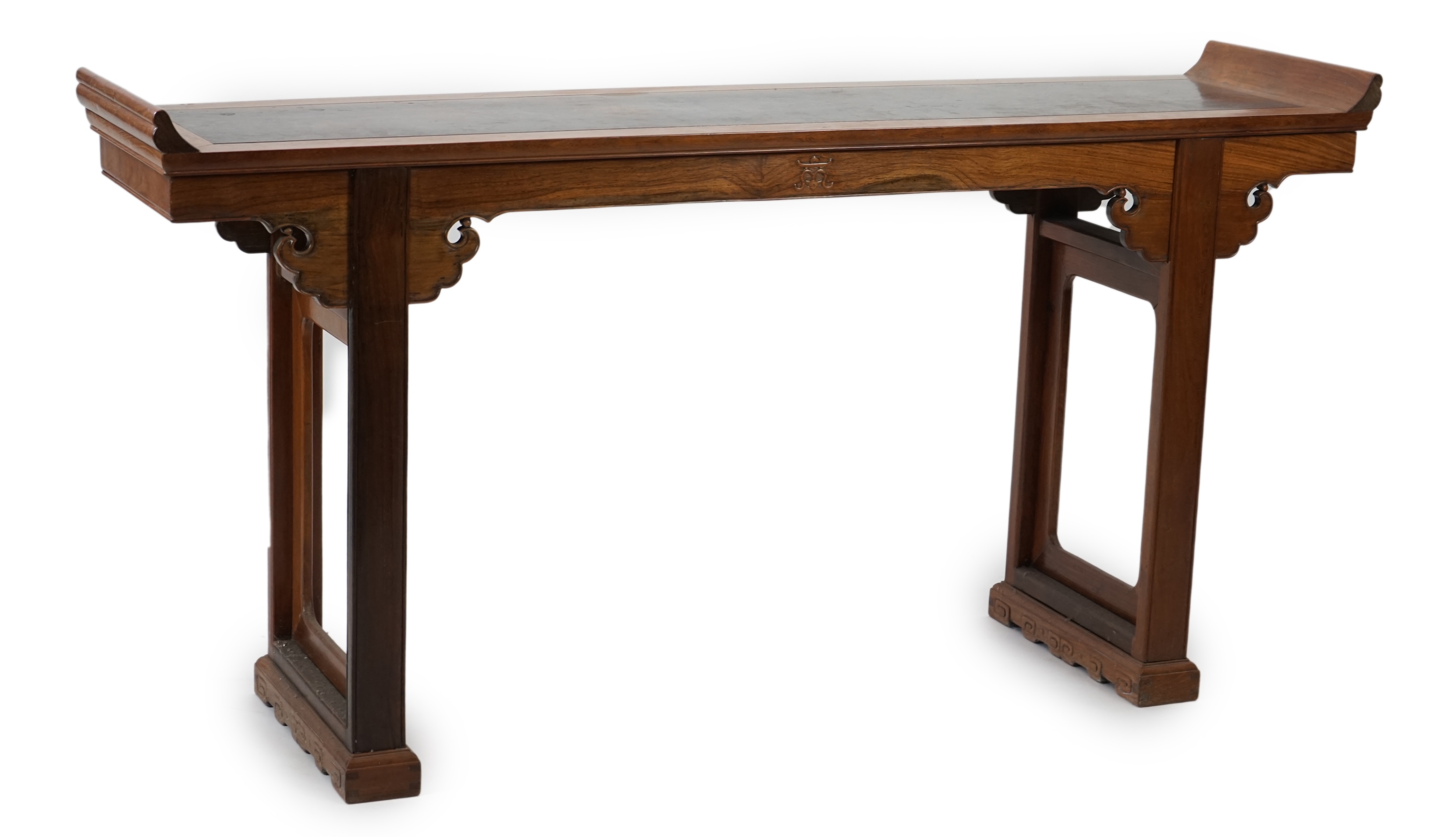 A Chinese padouk wood and jichimu altar table, the panelled rectangular top with scroll ends, on plain uprights headed by ruyi, 185cm wide, 94cm high. Condition - fair to good